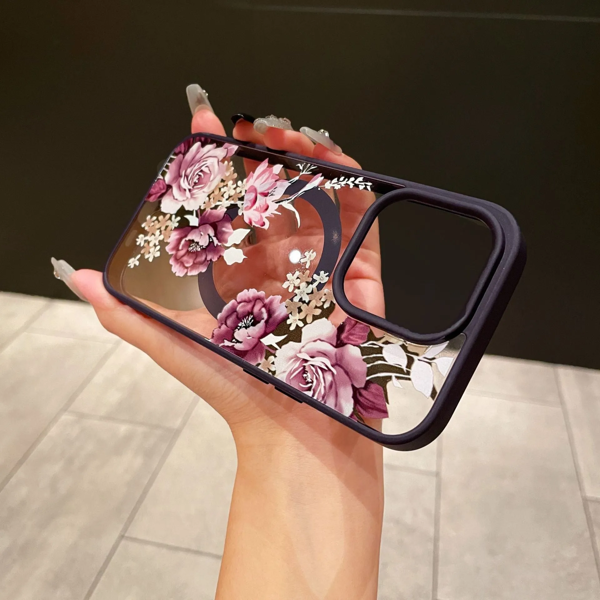Magnetic acrylic two-in-one phone case with purple floral design on black back for iPhone