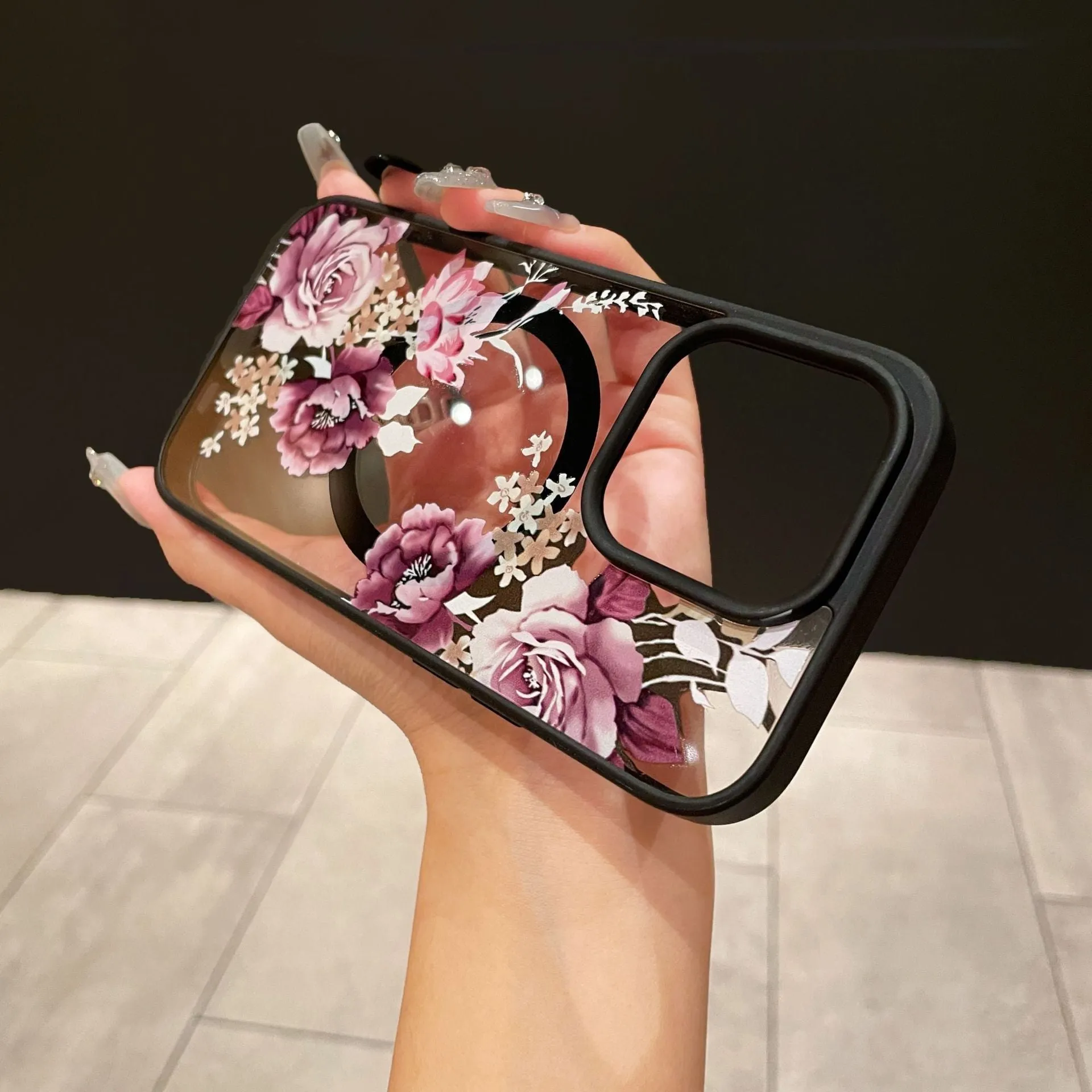 Magnetic acrylic two-in-one phone case with purple floral design on black back for iPhone