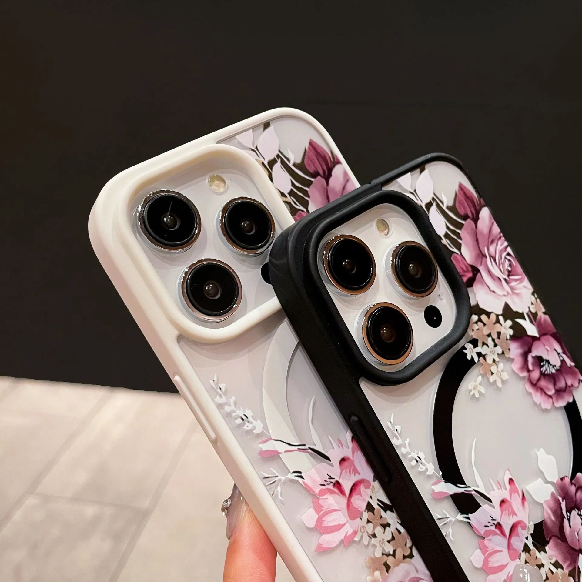Magnetic acrylic two-in-one phone case with purple floral design on black back for iPhone