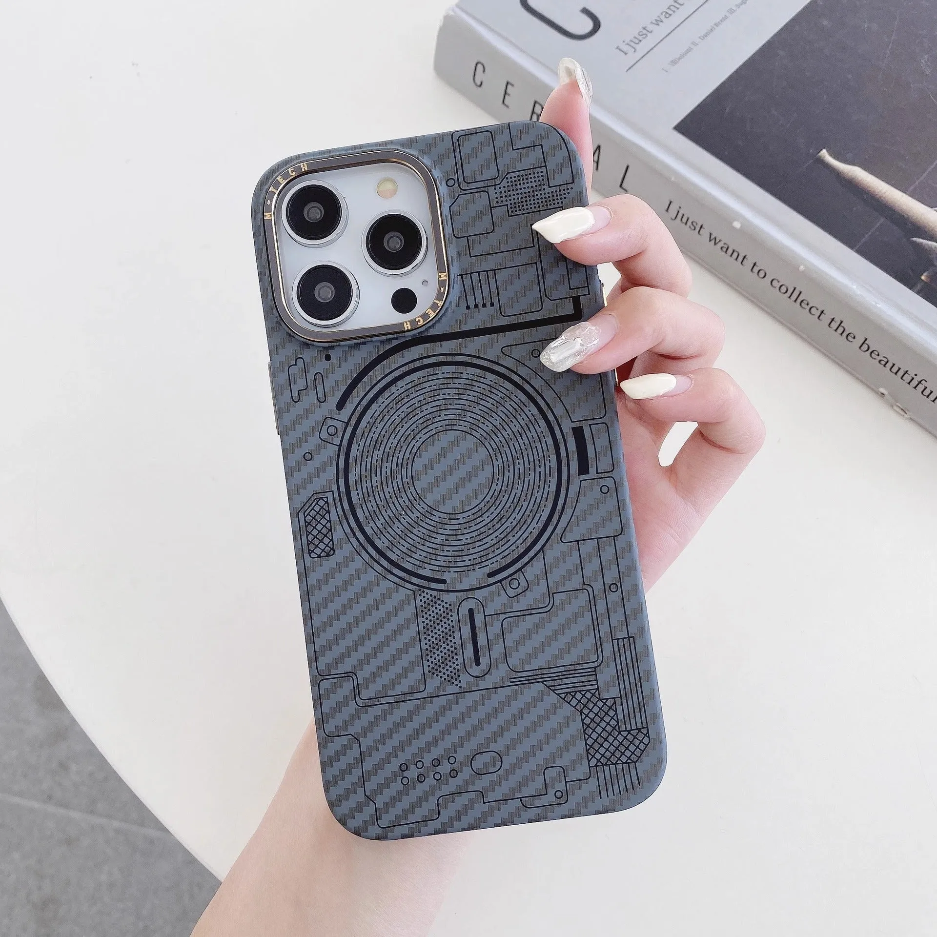 PC phone case with carbon fiber grain texture, Graphite Black colour, magnetic ring visible, for iPhone series.