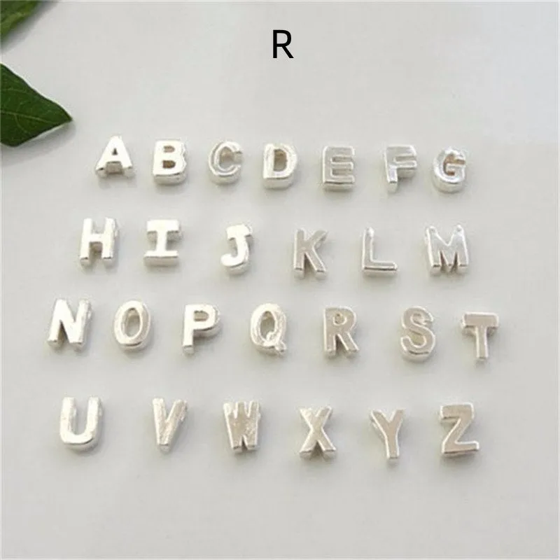 Peach heart shaped letter necklace pendant in gold or silver alloy, weighing 5.5g.