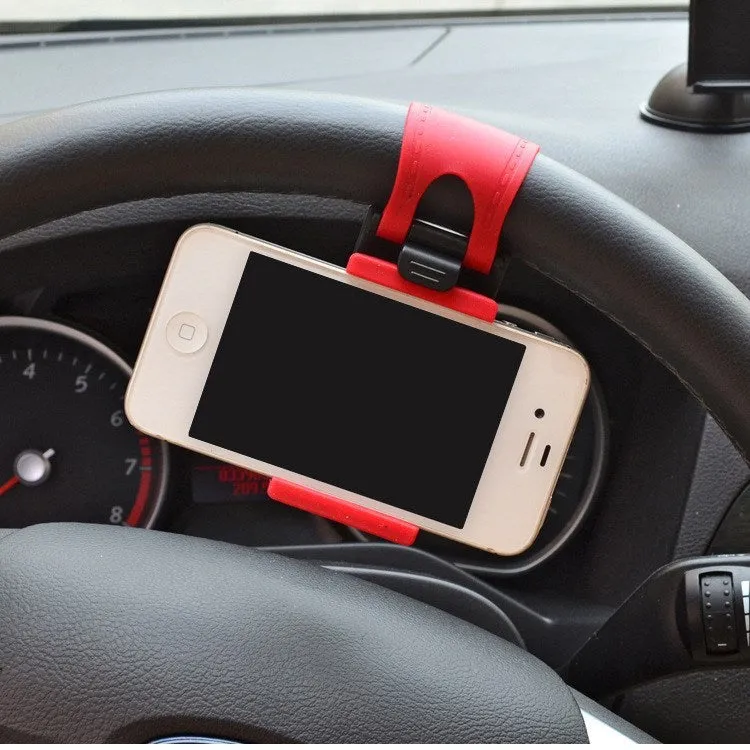 Universal black steering wheel phone holder mount clipped onto a car steering wheel.