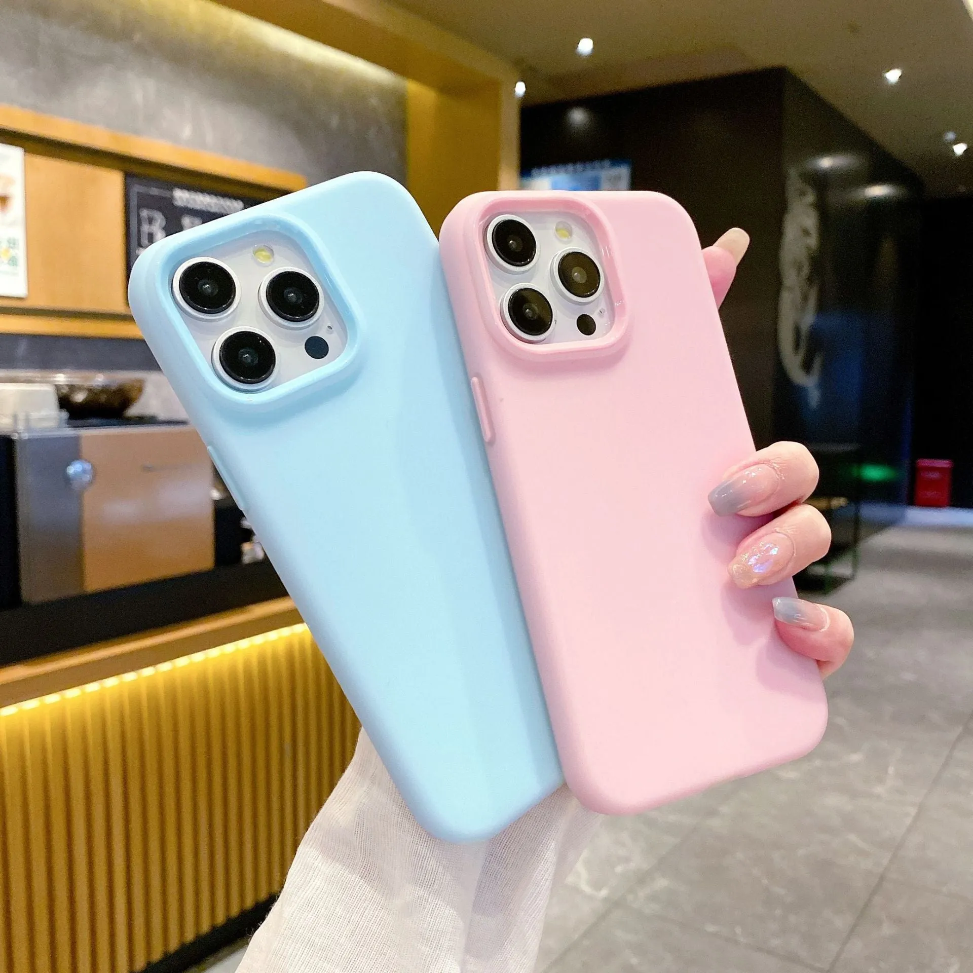 Liquid silicone dopamine phone case for Apple iPhone in blue, purple, and orange colour options