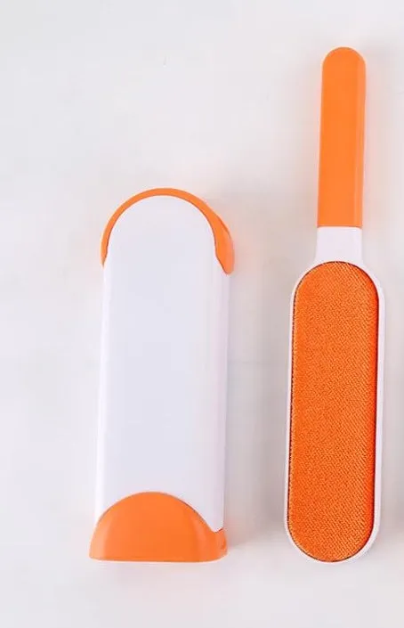 Blue reusable pet hair removal comb with double-sided sticky brush next to its self-cleaning base.