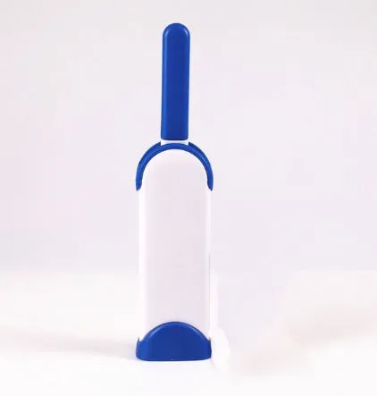 Blue reusable pet hair removal comb with double-sided sticky brush next to its self-cleaning base.