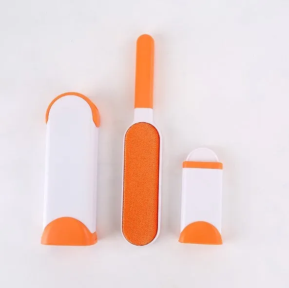 Blue reusable pet hair removal comb with double-sided sticky brush next to its self-cleaning base.