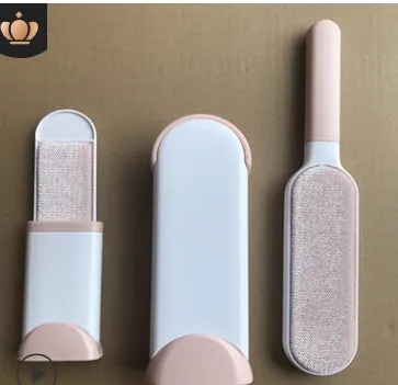 Blue reusable pet hair removal comb with double-sided sticky brush next to its self-cleaning base.