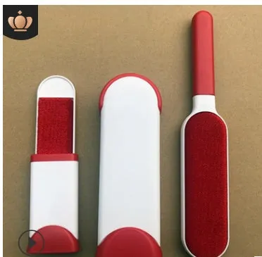 Blue reusable pet hair removal comb with double-sided sticky brush next to its self-cleaning base.