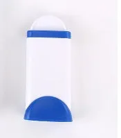 Blue reusable pet hair removal comb with double-sided sticky brush next to its self-cleaning base.