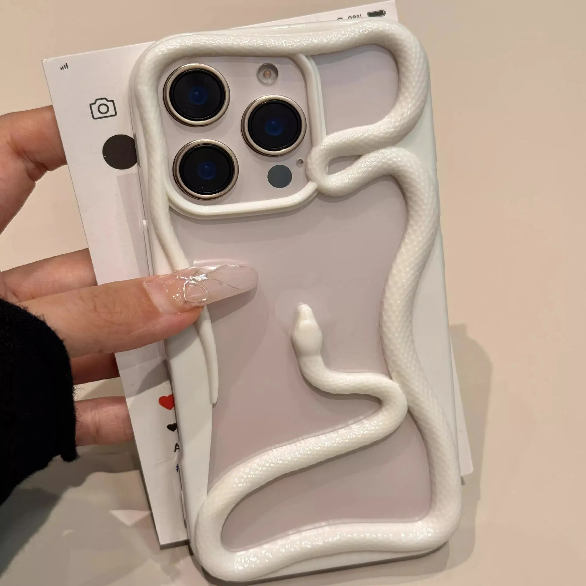 Creative hollow snake TPU phone case in matte rose pink for iPhone
