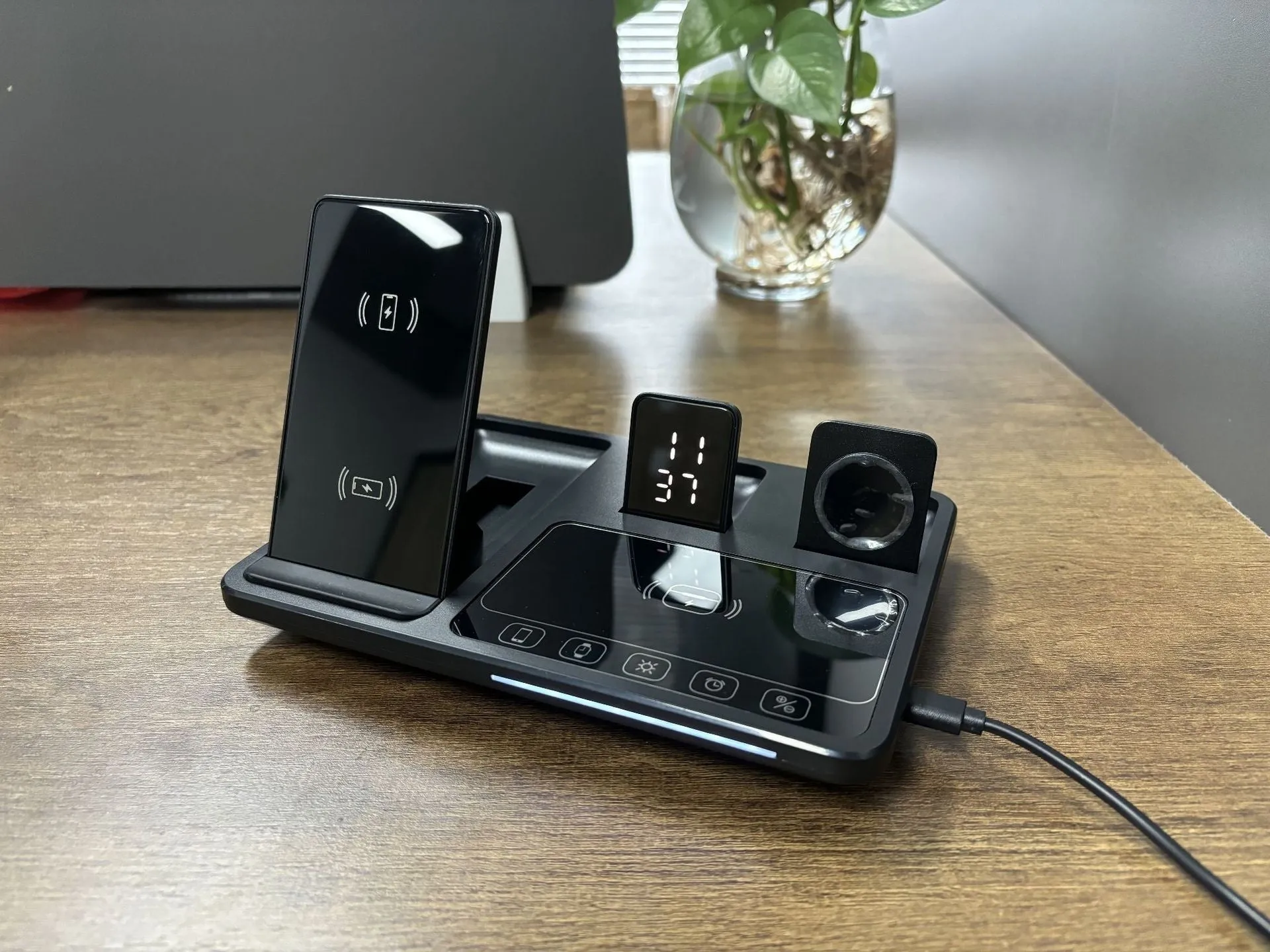 Multifunctional wireless fast charging clock with folding bracket, black plastic version, charging a phone upright