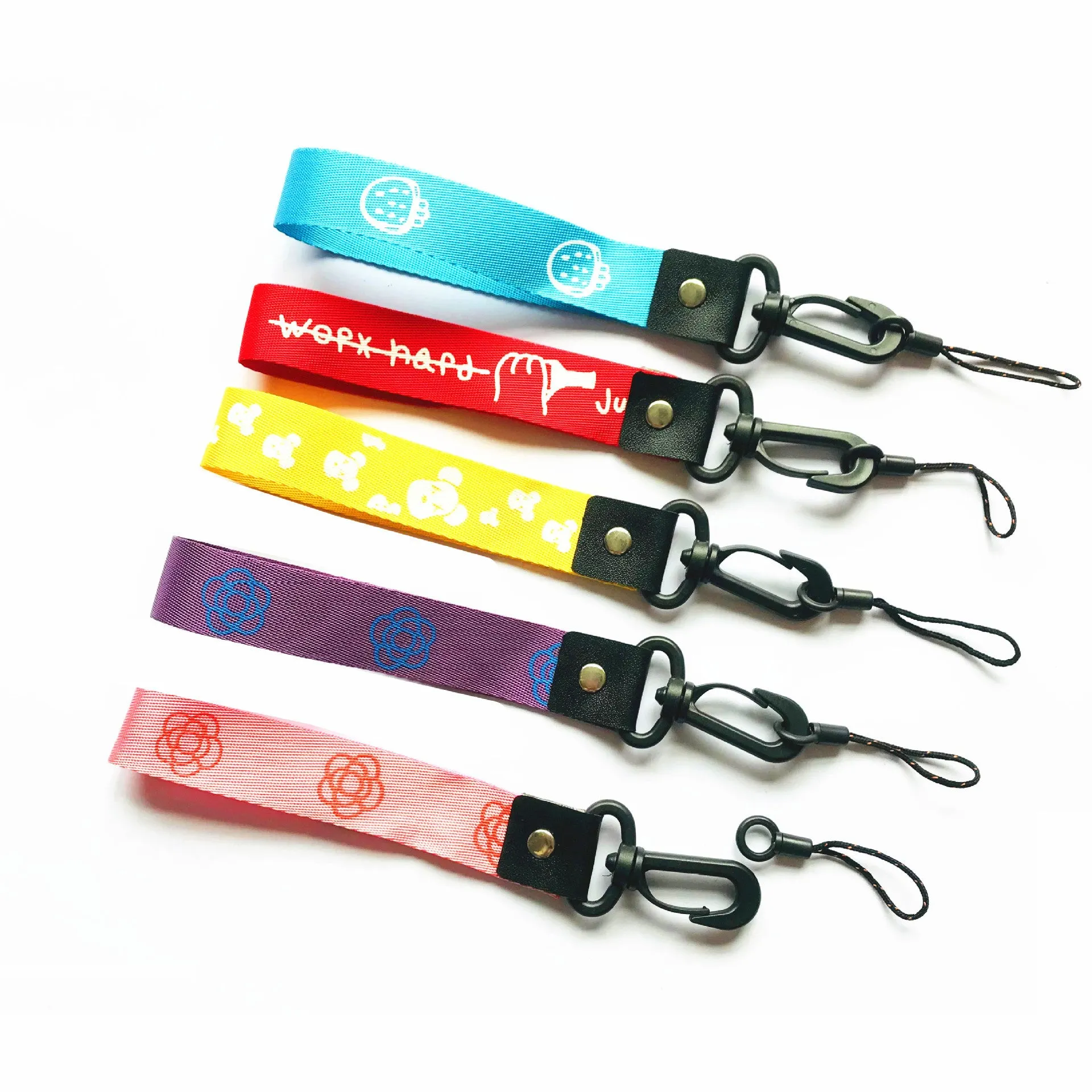 Short 25cm printed polyester mobile phone lanyard with 2-in-1 hooks in mixed colour on a wrist