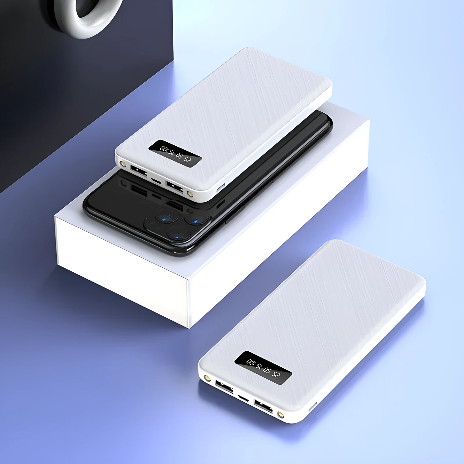 Black power bank with PVC shell, detachable cable, and light display showing battery level