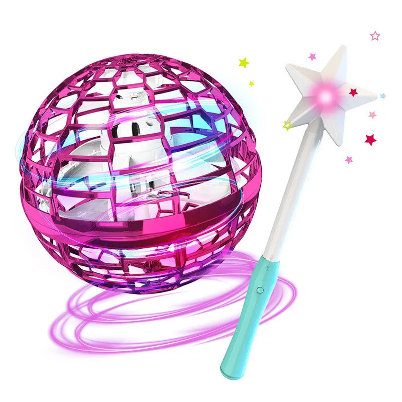 Blue spinning flying ball toy with LED lights floating above child's hand with magic wand