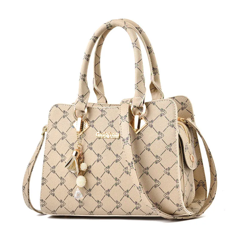 Women's geometric print messenger bag in PU material with stitching detail and zip closure
