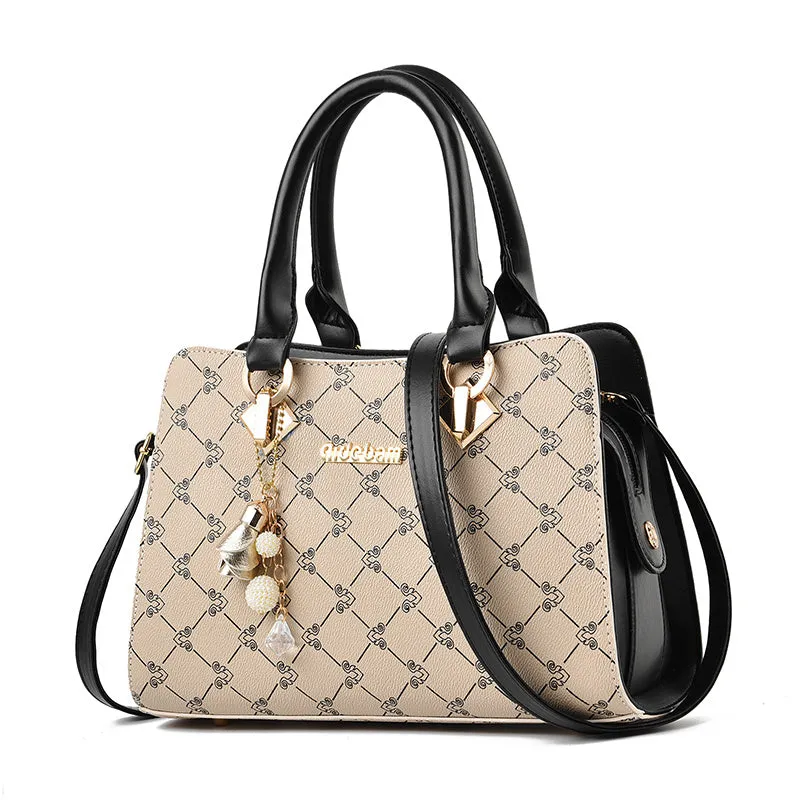 Women's geometric print messenger bag in PU material with stitching detail and zip closure
