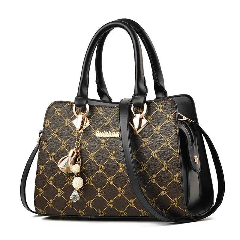Women's geometric print messenger bag in PU material with stitching detail and zip closure
