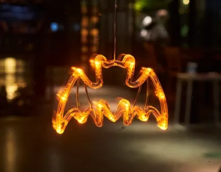 Seven Halloween LED window lights with spider, pumpkin, and ghost designs featuring suction cups for mounting