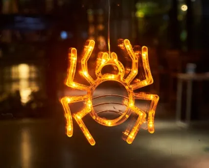 Seven Halloween LED window lights with spider, pumpkin, and ghost designs featuring suction cups for mounting