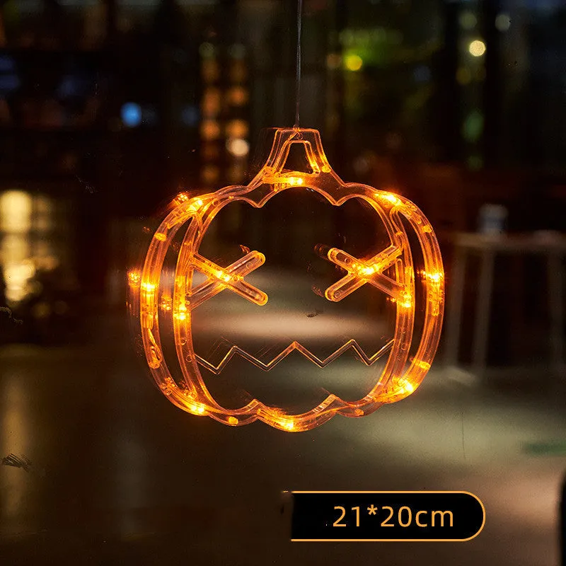 Seven Halloween LED window lights with spider, pumpkin, and ghost designs featuring suction cups for mounting