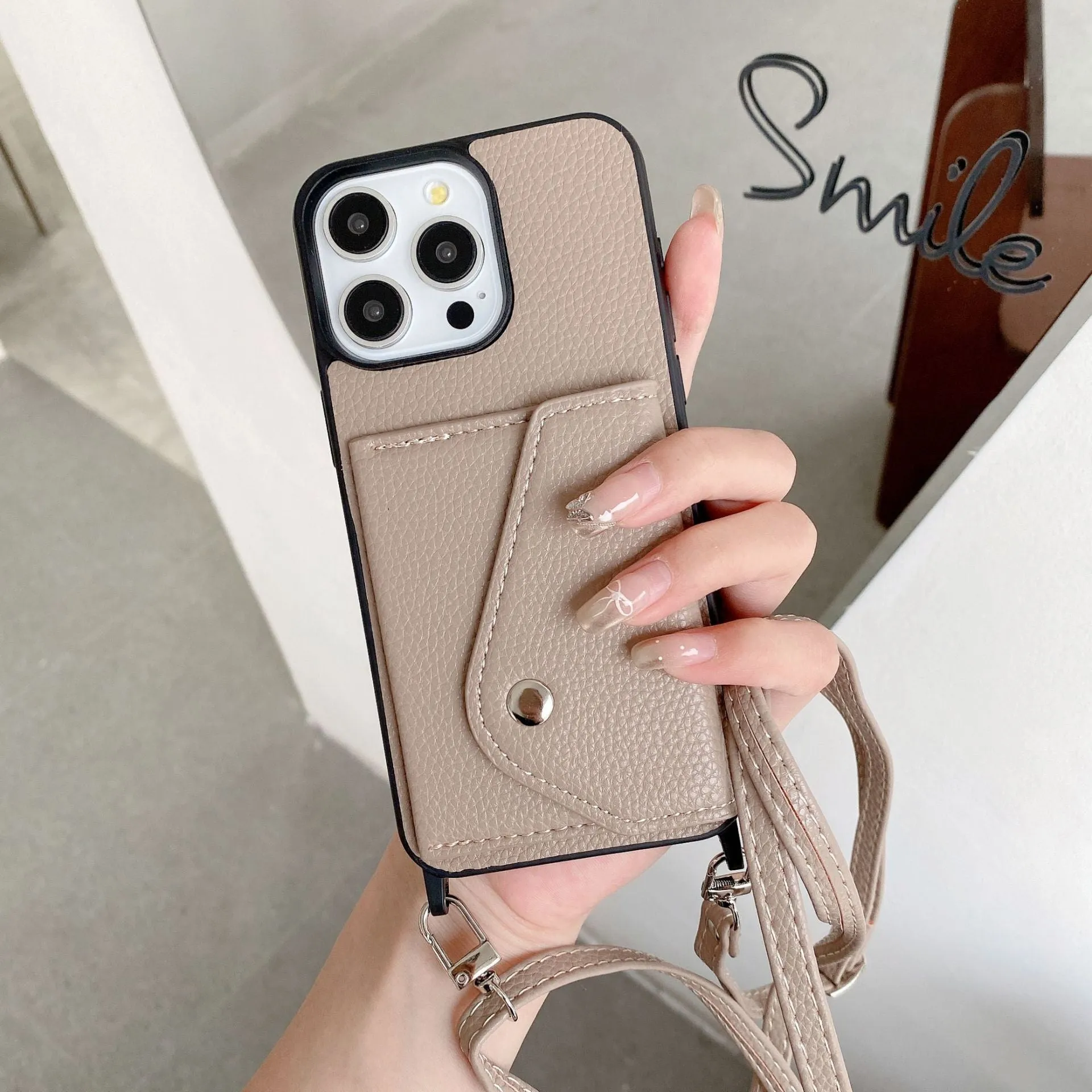 Lychee pattern imitation leather phone case with crossbody strap and triangle card holder for iPhone 14
