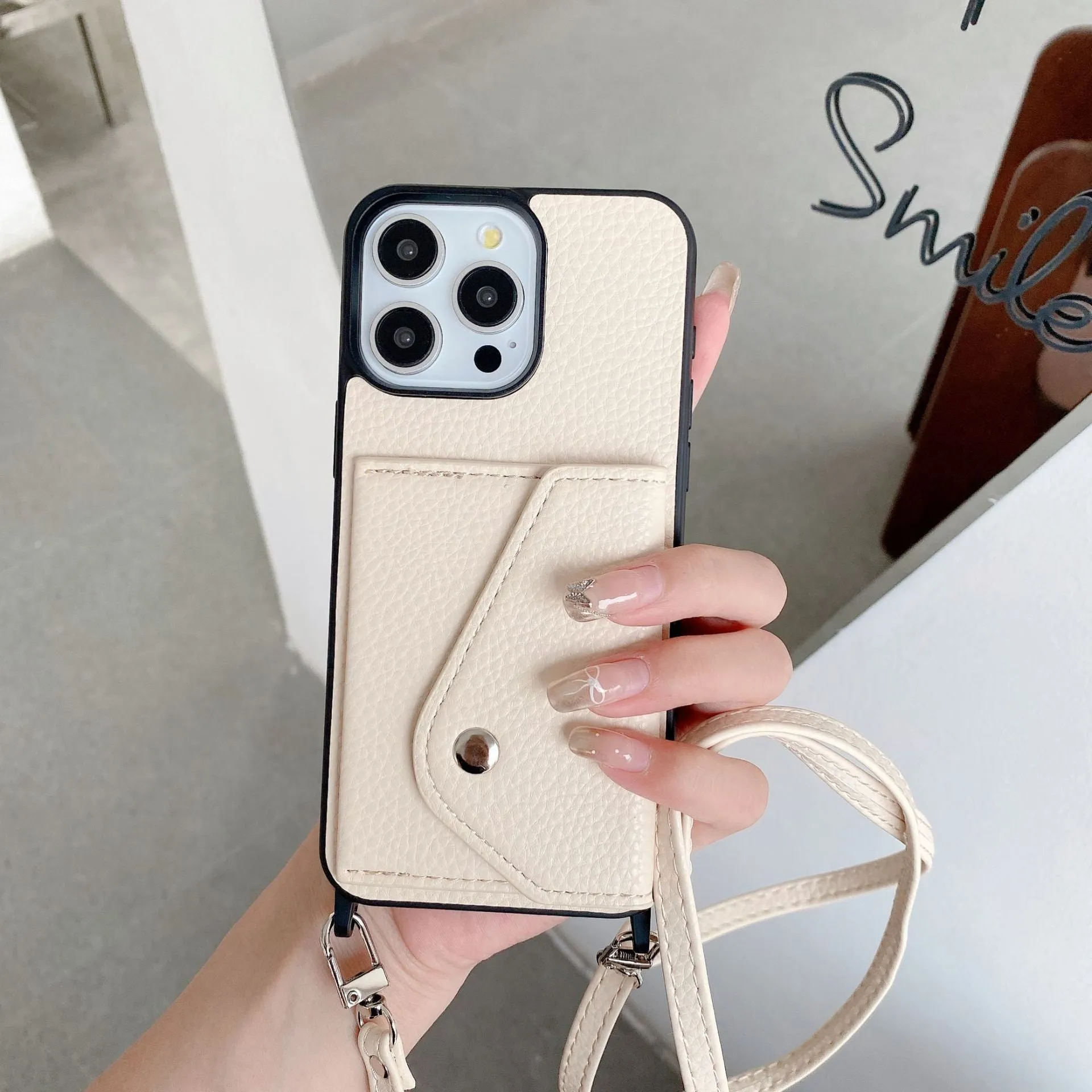 Lychee pattern imitation leather phone case with crossbody strap and triangle card holder for iPhone 14