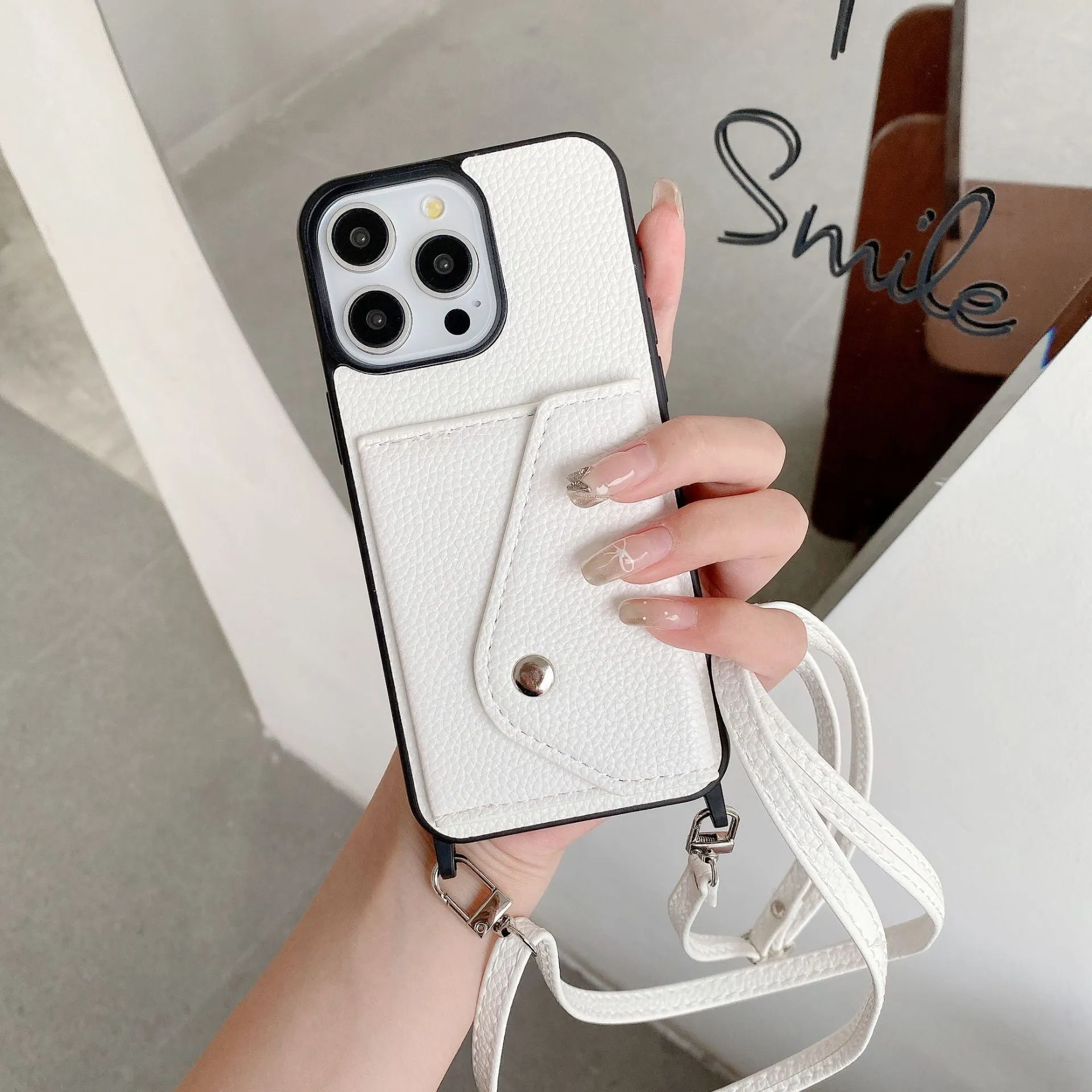 Lychee pattern imitation leather phone case with crossbody strap and triangle card holder for iPhone 14