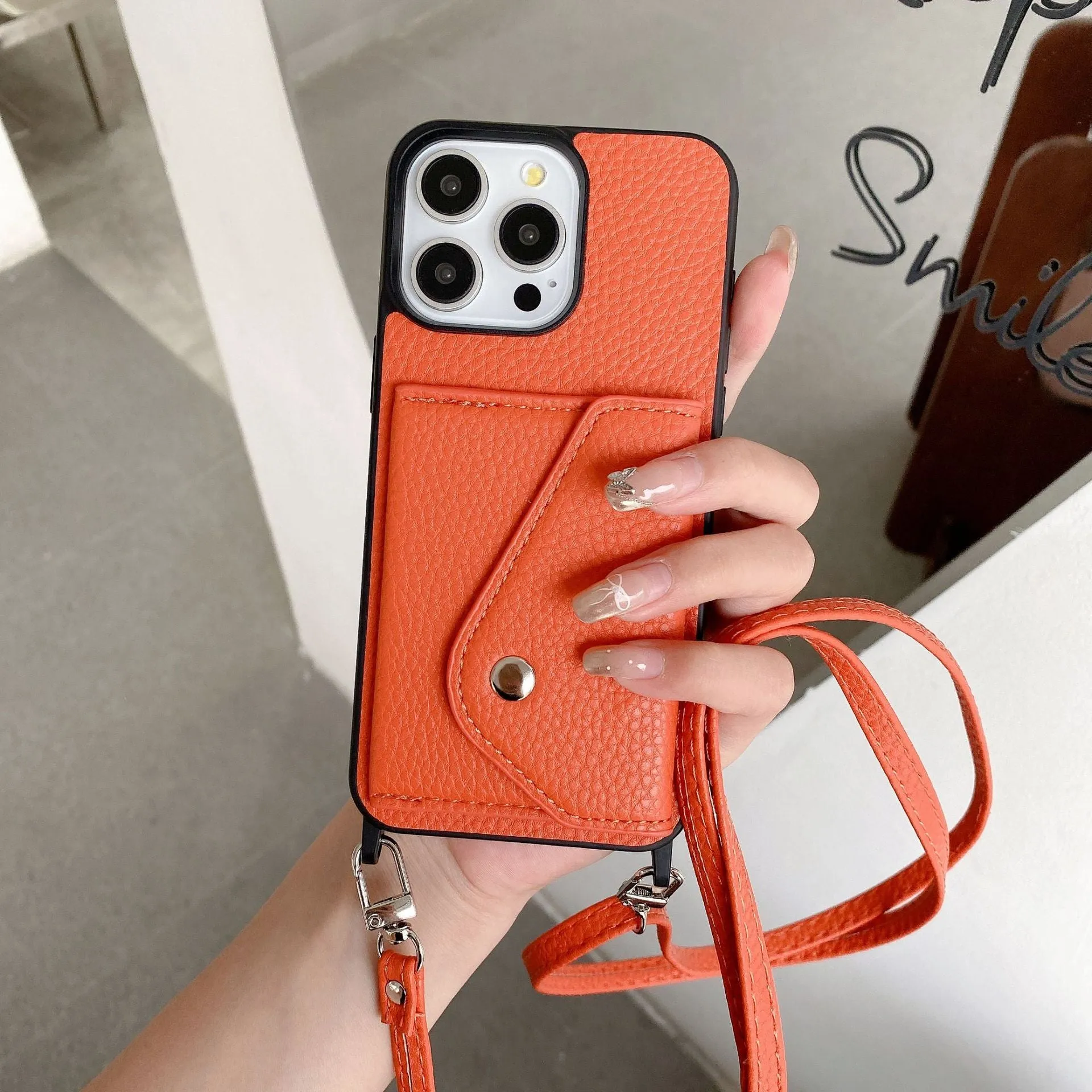 Lychee pattern imitation leather phone case with crossbody strap and triangle card holder for iPhone 14