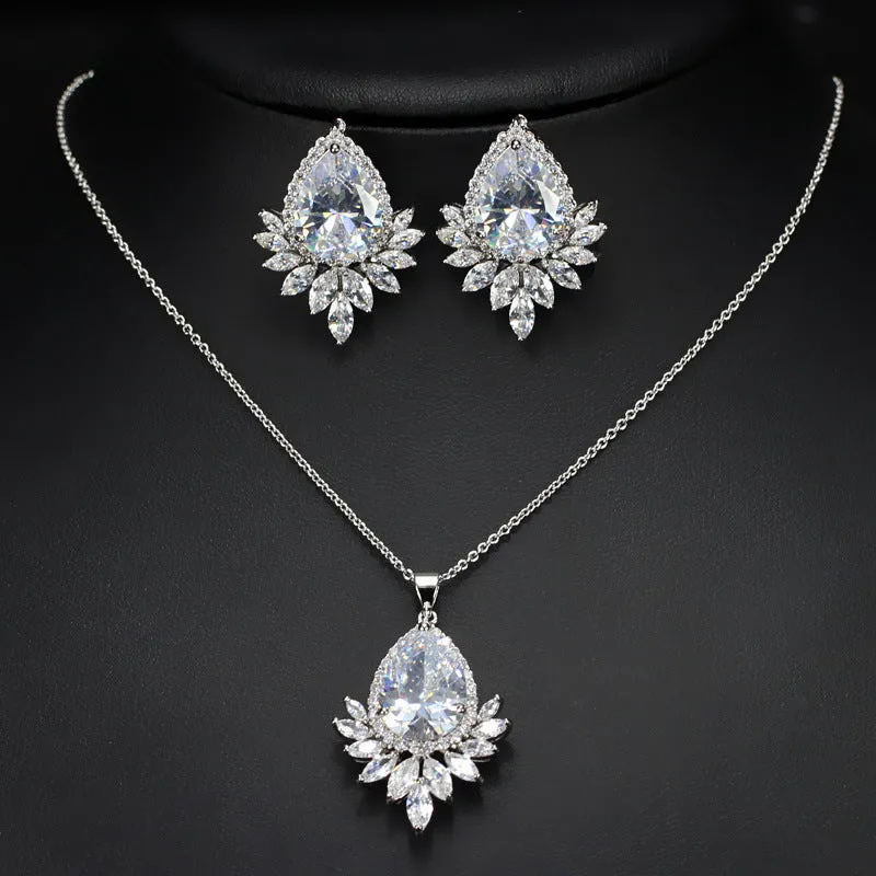 AAA formal jewellery set with chain link necklace, earrings, and pendant featuring cubic zirconia stones in blue, red, or white.
