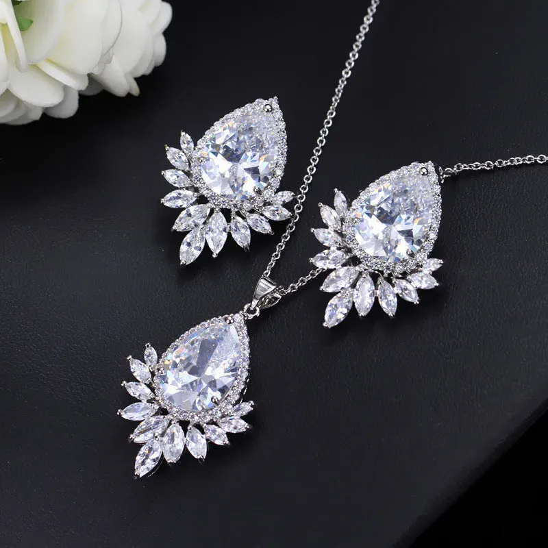 AAA formal jewellery set with chain link necklace, earrings, and pendant featuring cubic zirconia stones in blue, red, or white.