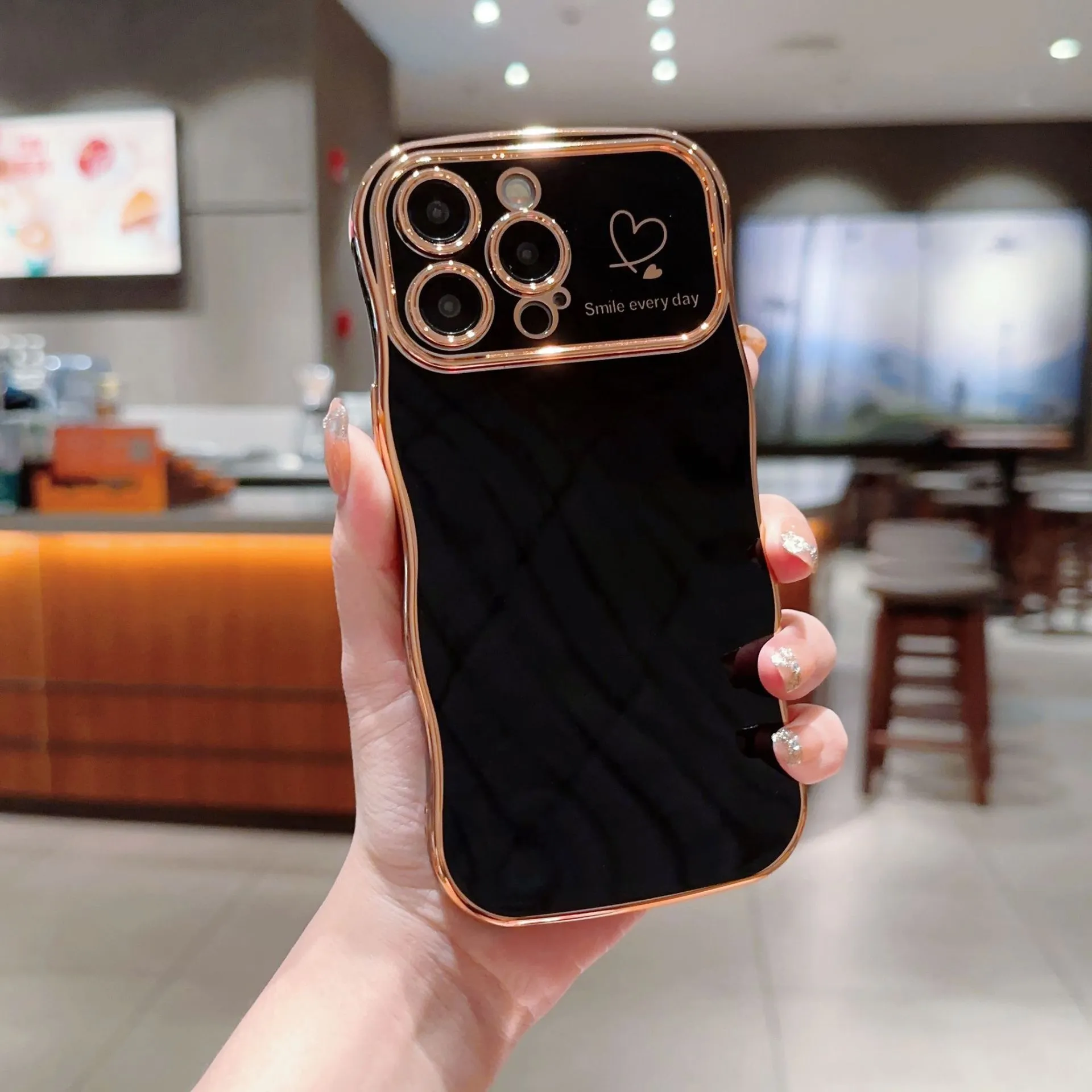 Electroplating wave love large window phone case in black, side view showing back cover and cutouts for iPhone