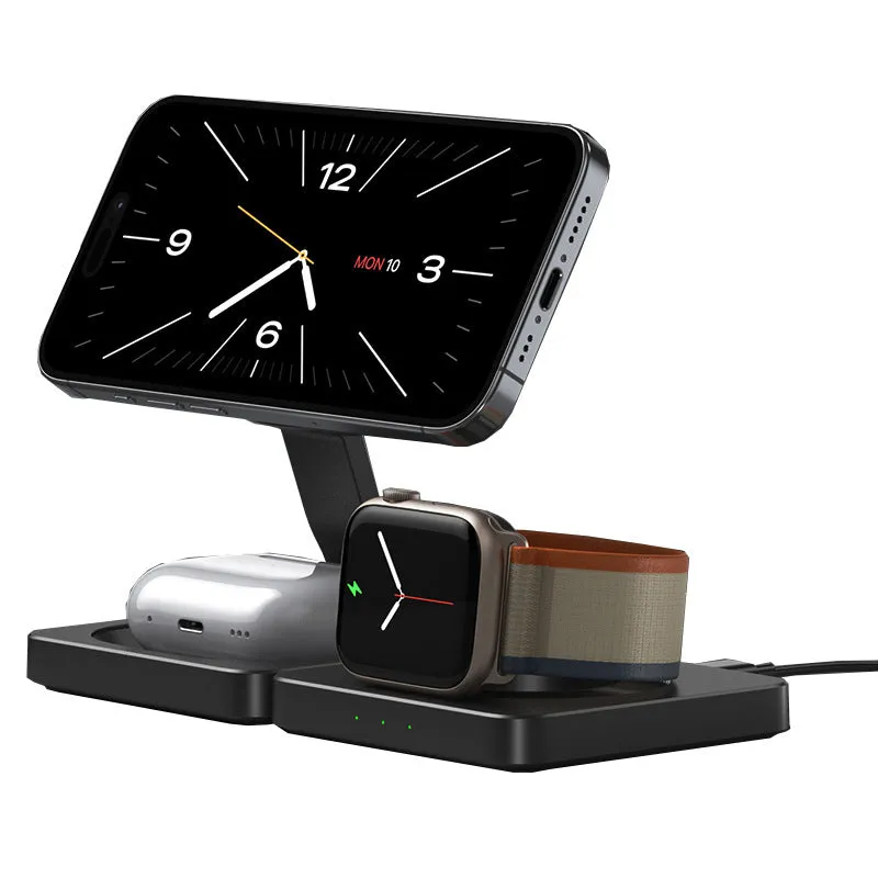 Three in one folding magnetic wireless charger in black, folded flat on a desk showing charging pads for phone and watch
