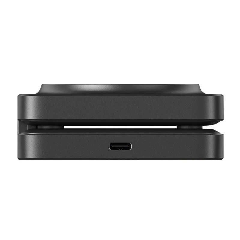 Three in one folding magnetic wireless charger in black, folded flat on a desk showing charging pads for phone and watch
