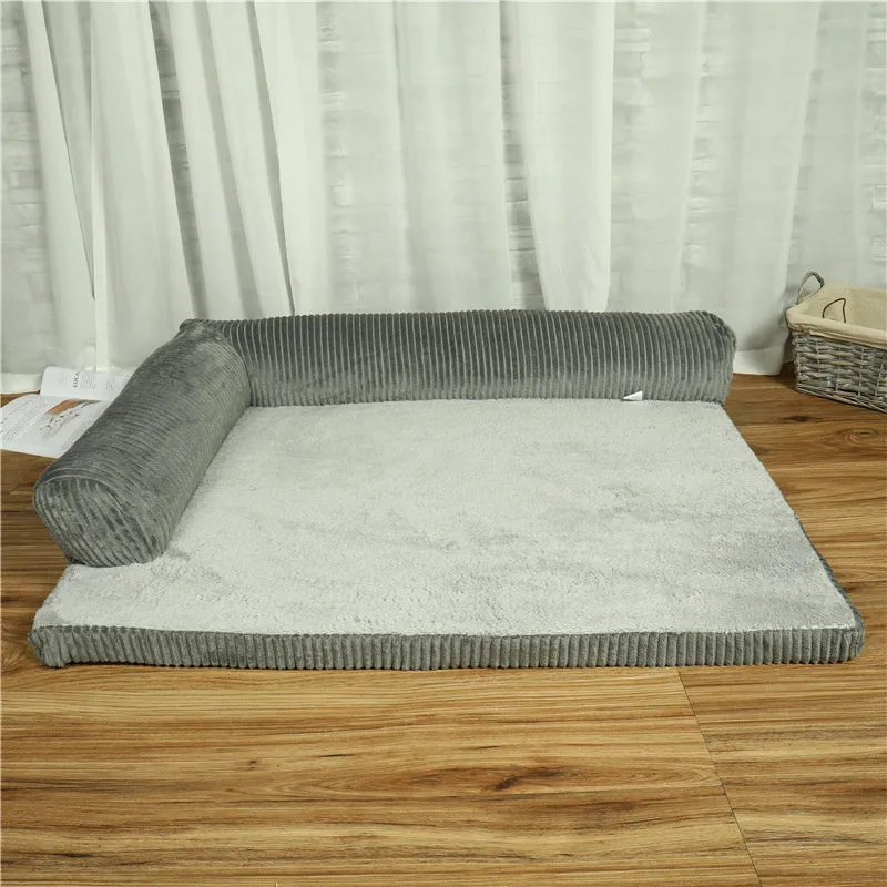 Corduroy pet dog sofa with bolster sides on a non-slip cloth base, shown in grey colour.