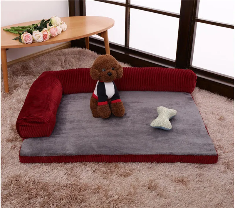 Corduroy pet dog sofa with bolster sides on a non-slip cloth base, shown in grey colour.