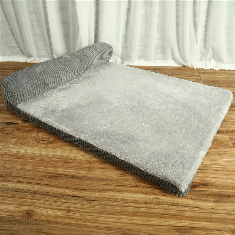 Corduroy pet dog sofa with bolster sides on a non-slip cloth base, shown in grey colour.