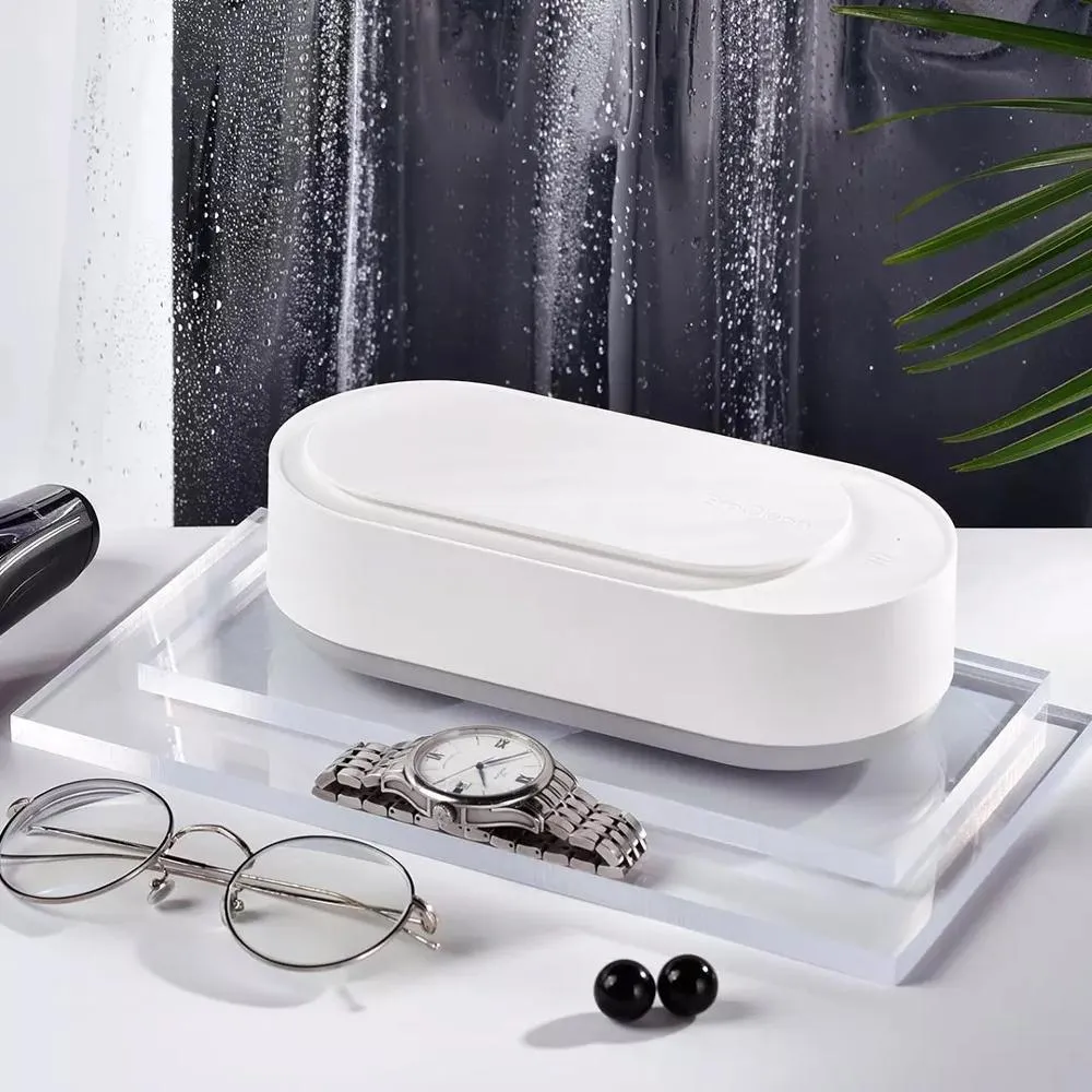 White portable ultrasonic cleaning machine with stainless steel tank and touch button.