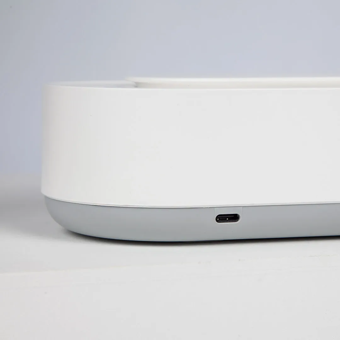 White portable ultrasonic cleaning machine with stainless steel tank and touch button.