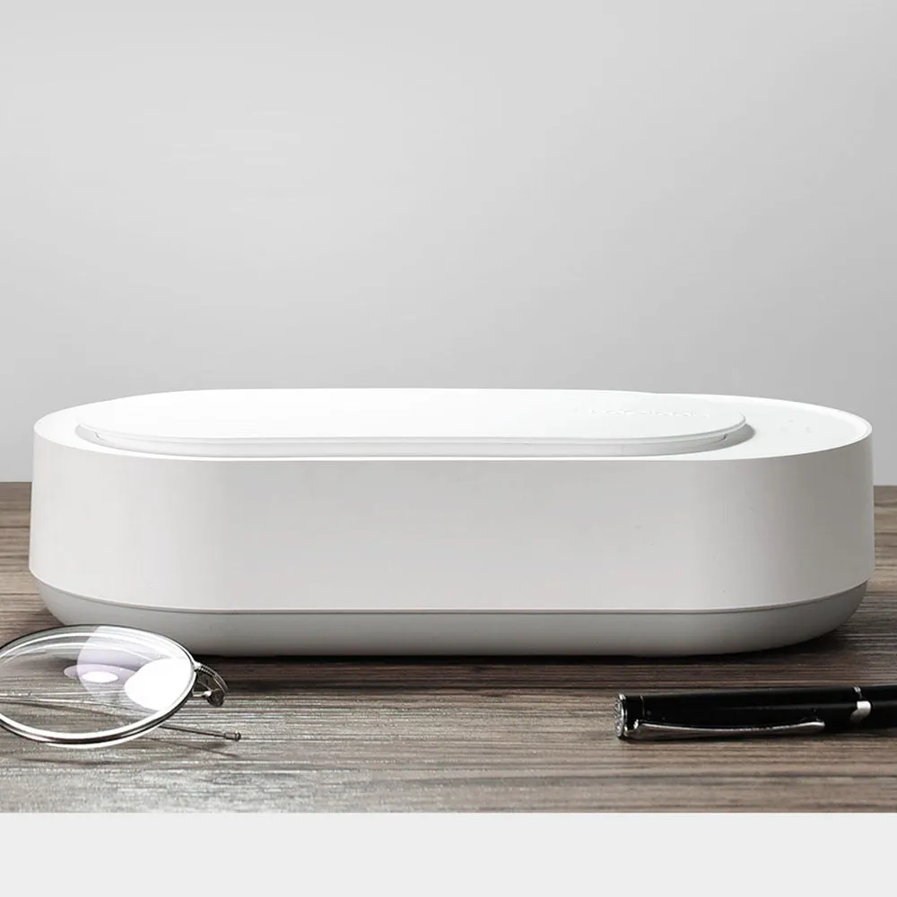 White portable ultrasonic cleaning machine with stainless steel tank and touch button.