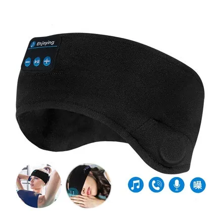 A black wireless Bluetooth sleep mask with built-in small earphones, shown on a model, designed for comfortable, pressure-free music listening during rest.