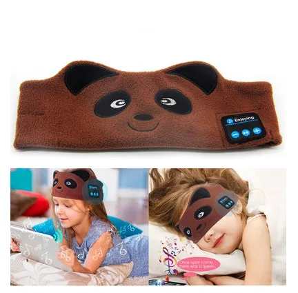 A black wireless Bluetooth sleep mask with built-in small earphones, shown on a model, designed for comfortable, pressure-free music listening during rest.