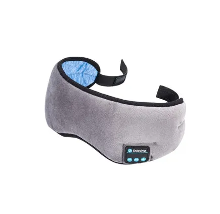 A black wireless Bluetooth sleep mask with built-in small earphones, shown on a model, designed for comfortable, pressure-free music listening during rest.