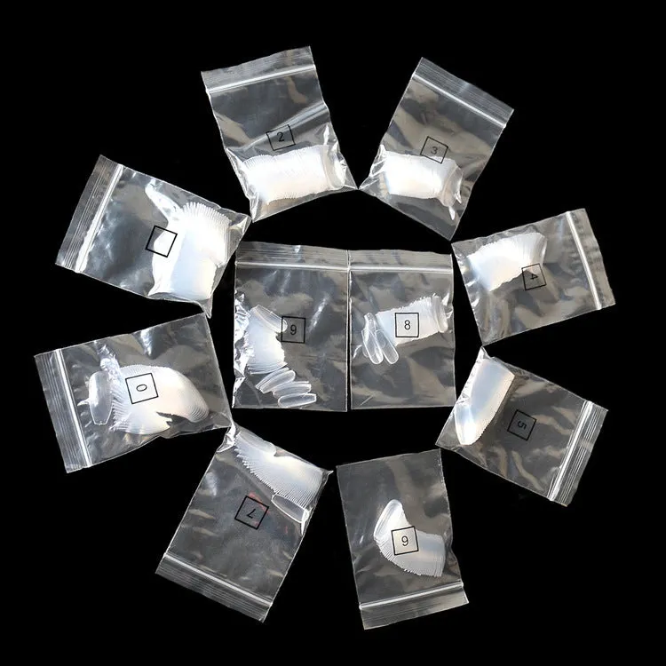 500 clear natural acrylic false nails in various sizes on a white background.