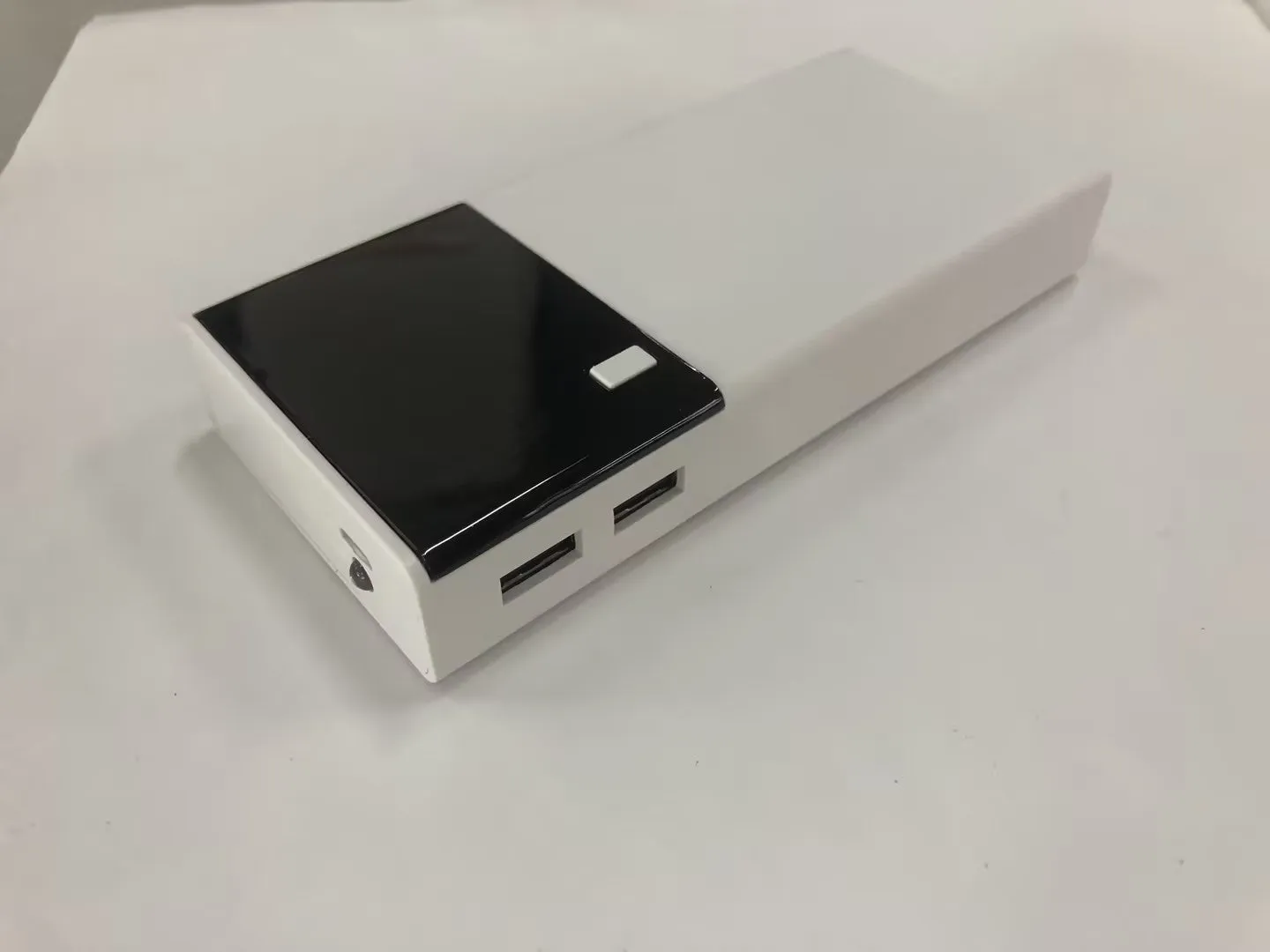 Black 20000mAh power bank with aluminium shell 18650 batteries showing charging port