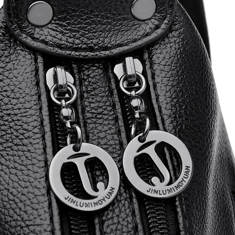 Large black women's crossbody shoulder bag with multiple internal compartments and zip closure