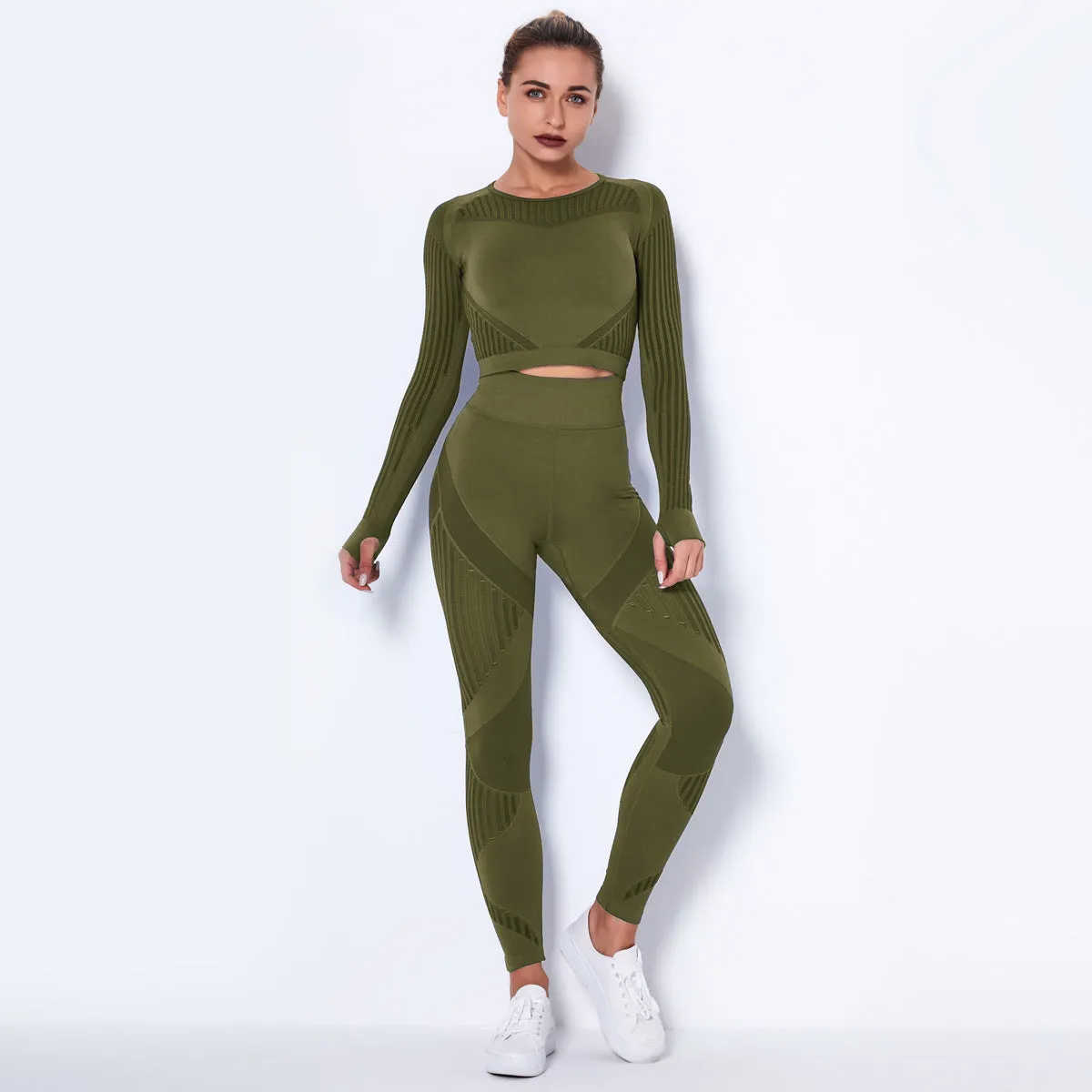 Woman wearing a seamless long-sleeved yoga suit in a neutral colour, demonstrating a stretch pose.