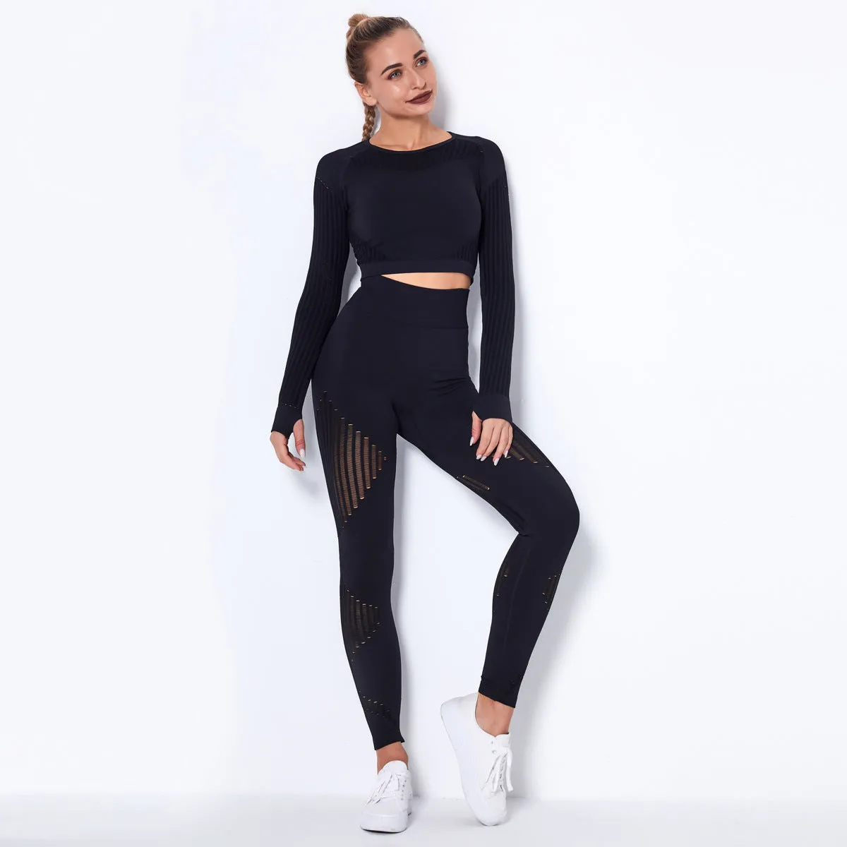 Woman wearing a seamless long-sleeved yoga suit in a neutral colour, demonstrating a stretch pose.