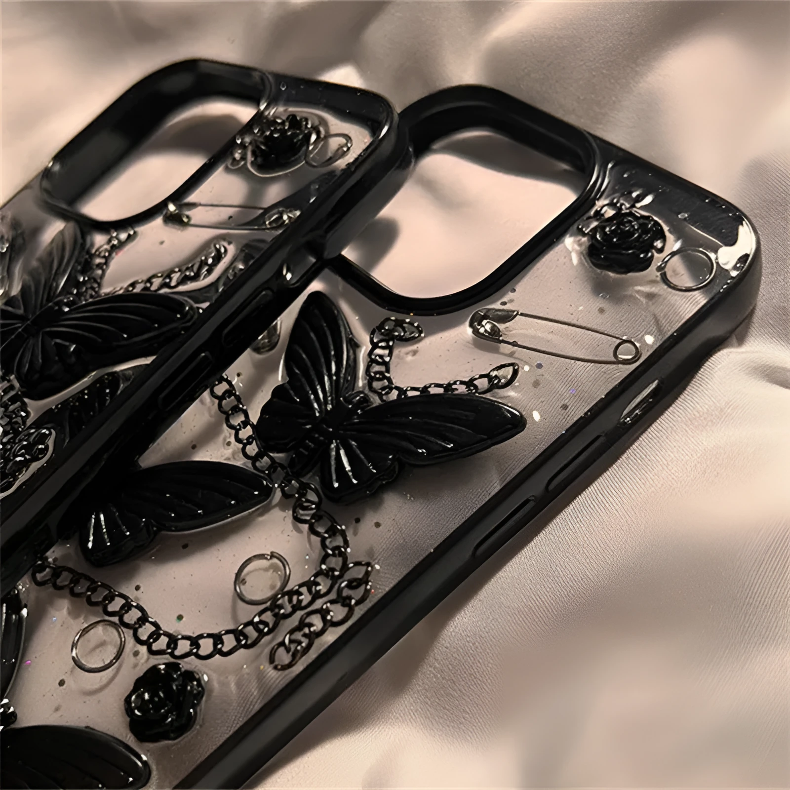 Black silicone phone case with three-dimensional butterfly design for Apple iPhone drop protection
