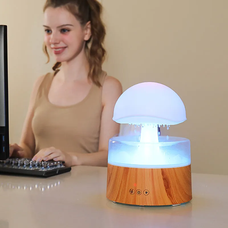 White cloud-shaped humidifier with rainfall effect and colour changing night light