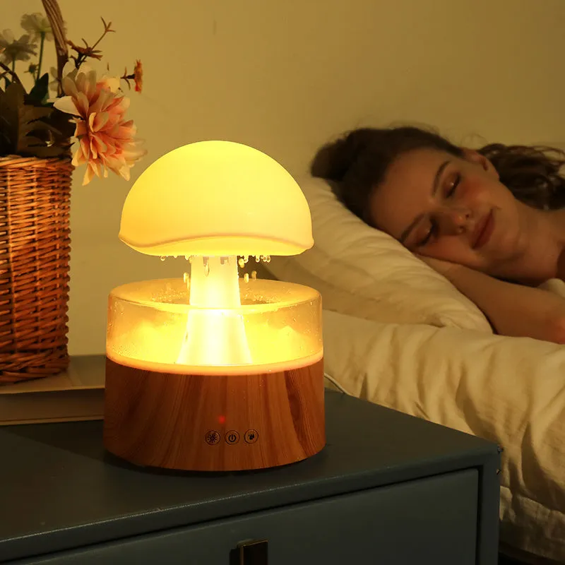 White cloud-shaped humidifier with rainfall effect and colour changing night light